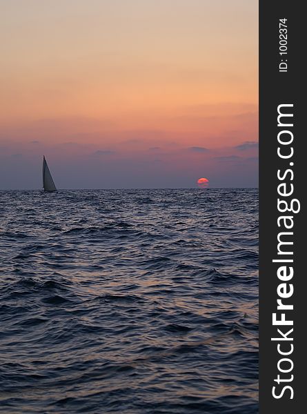 A Yacht in evening sea. A Yacht in evening sea
