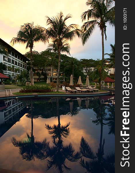 Evening at a city resort poolside. Evening at a city resort poolside