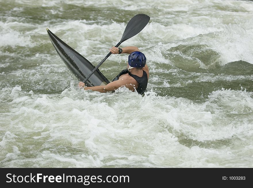 Adventurous Whitewater Kayaker in Rapids