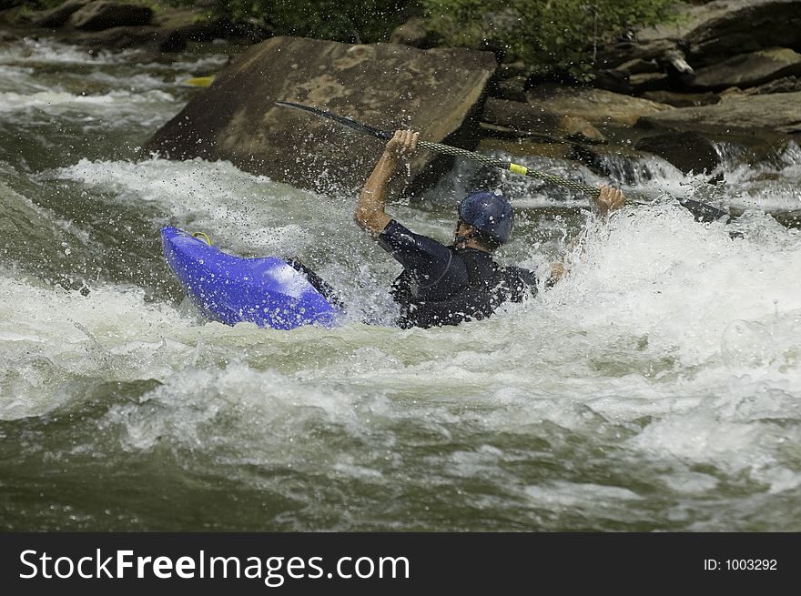 Adventurous Whitewater Kayaker in Rapids