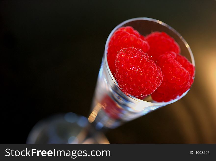 Raspberries in decorative shot glass. Raspberries in decorative shot glass