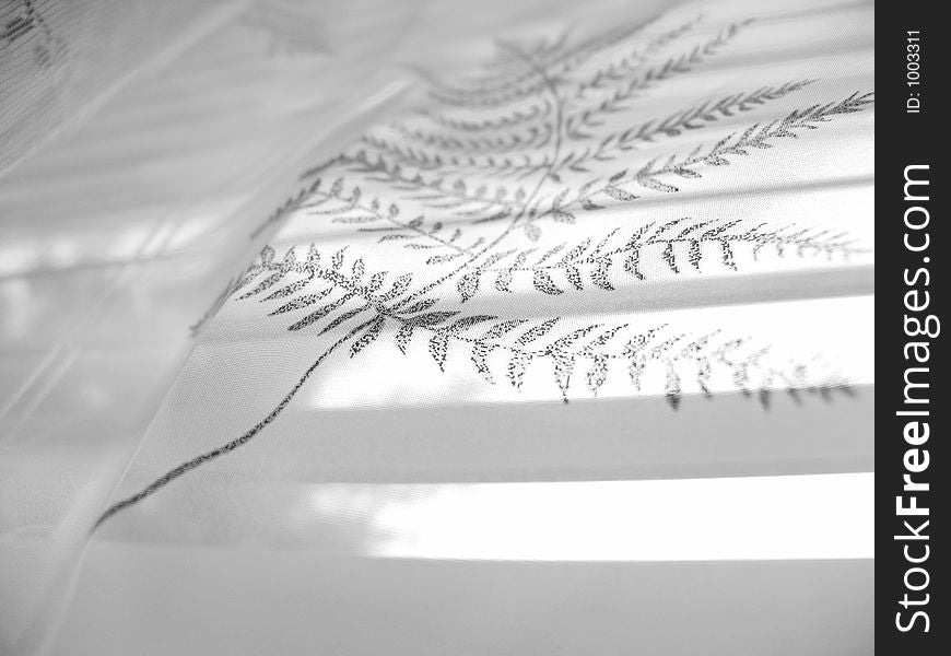 High-key abstract white lace curtain on white blinds background (high-resolution photo). High-key abstract white lace curtain on white blinds background (high-resolution photo)