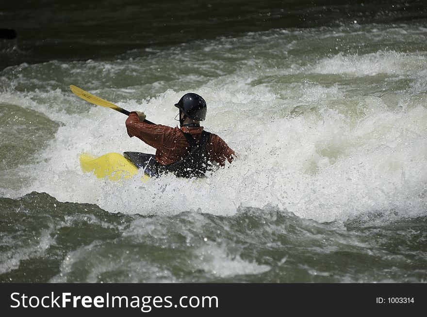 Adventurous Whitewater Kayaker in Rapids