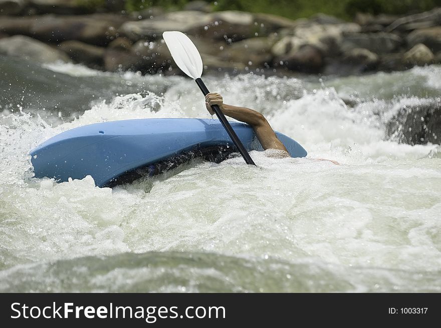 Adventurous Whitewater Kayaker in Rapids