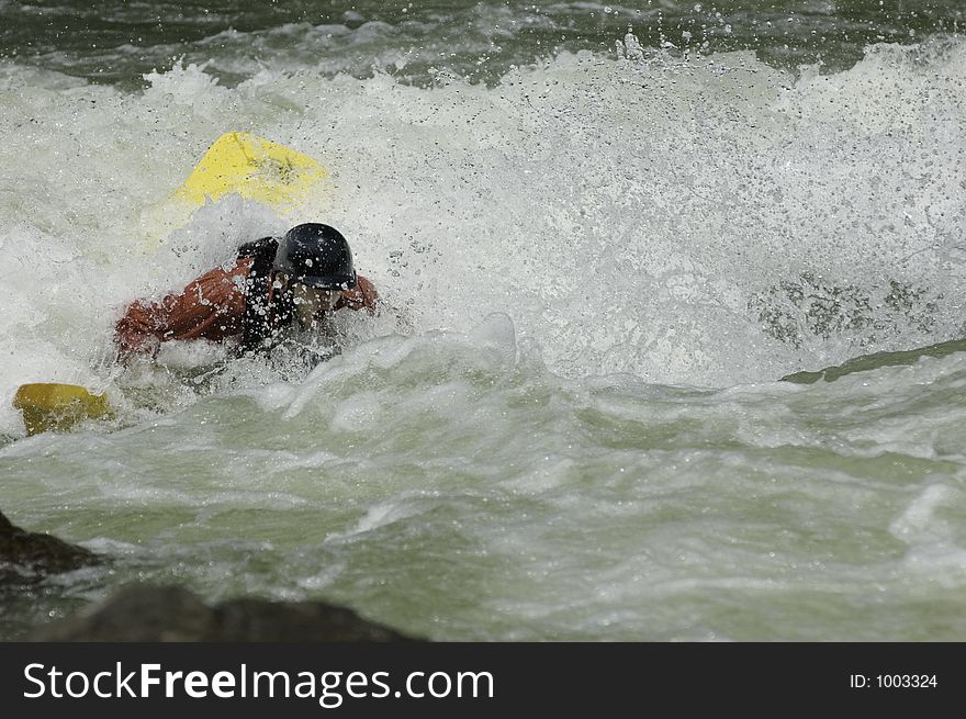 Adventurous Whitewater Kayaker in Rapids