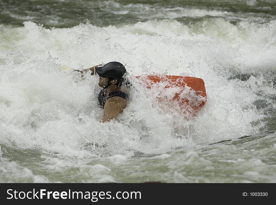 Adventurous Whitewater Kayaker in Rapids