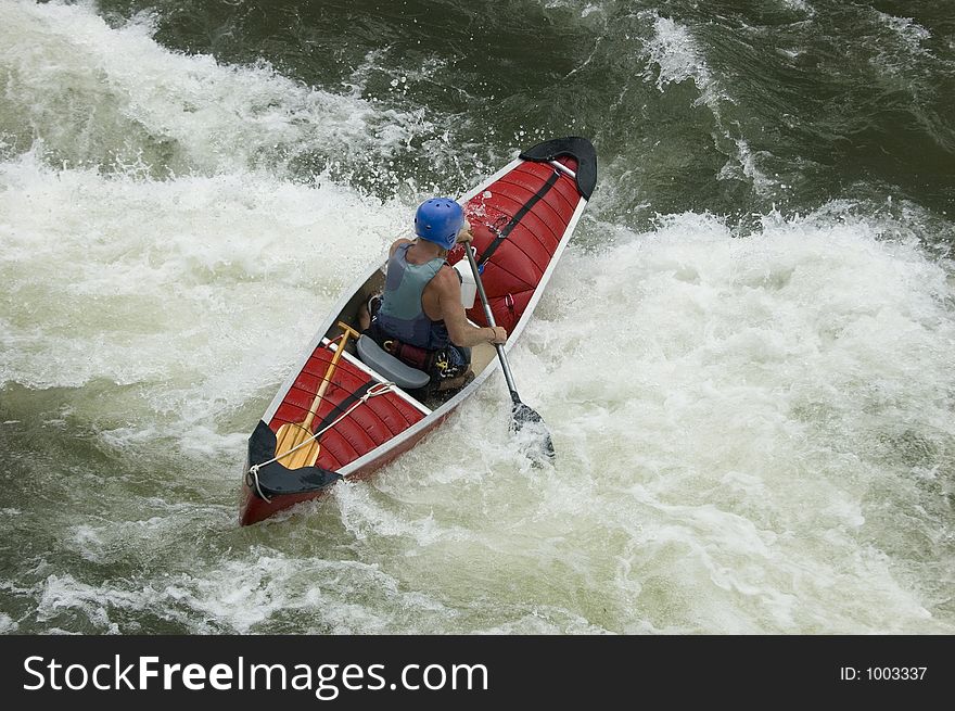 Adventurous Whitewater Kayaker in Rapids