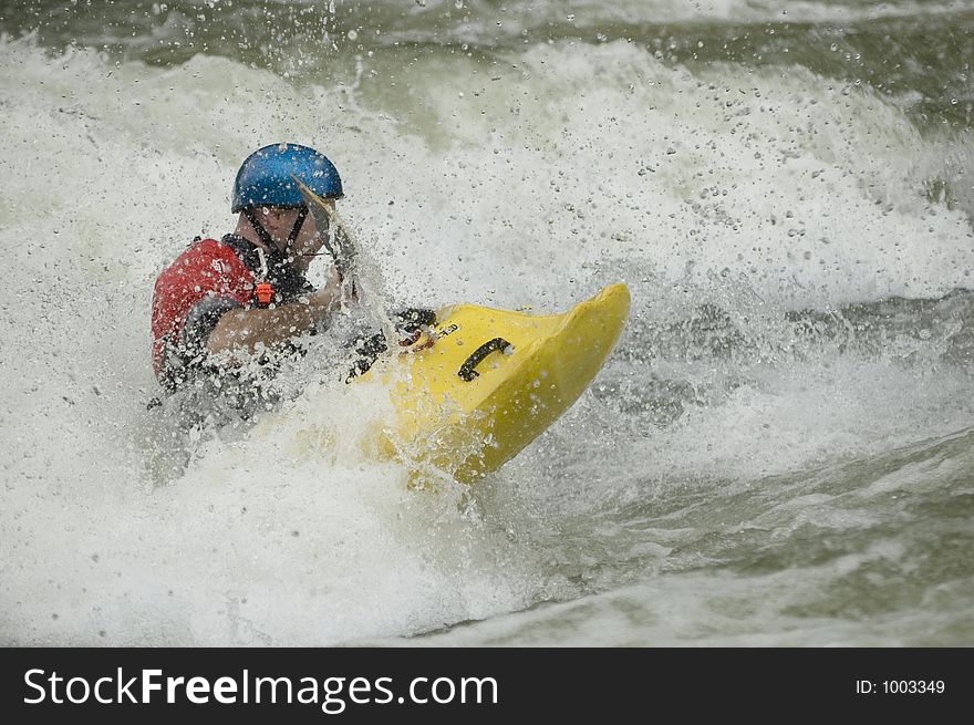 Adventurous Whitewater Kayaker in Rapids