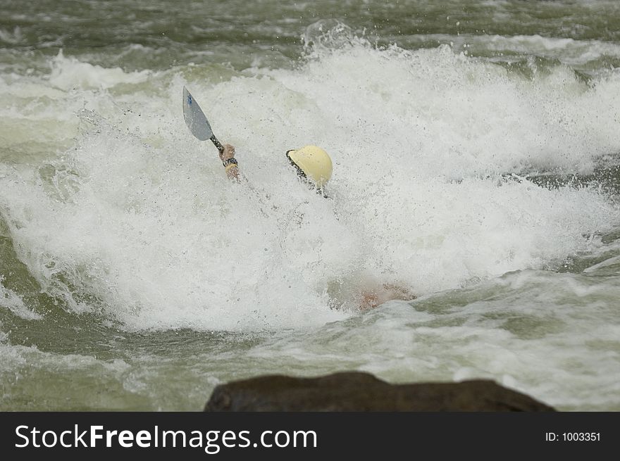 Adventurous Whitewater Kayaker in Rapids