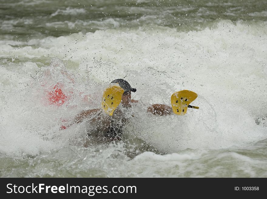 Adventurous Whitewater Kayaker in Rapids