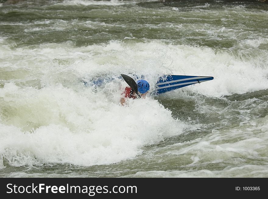 Adventurous Whitewater Kayaker in Rapids