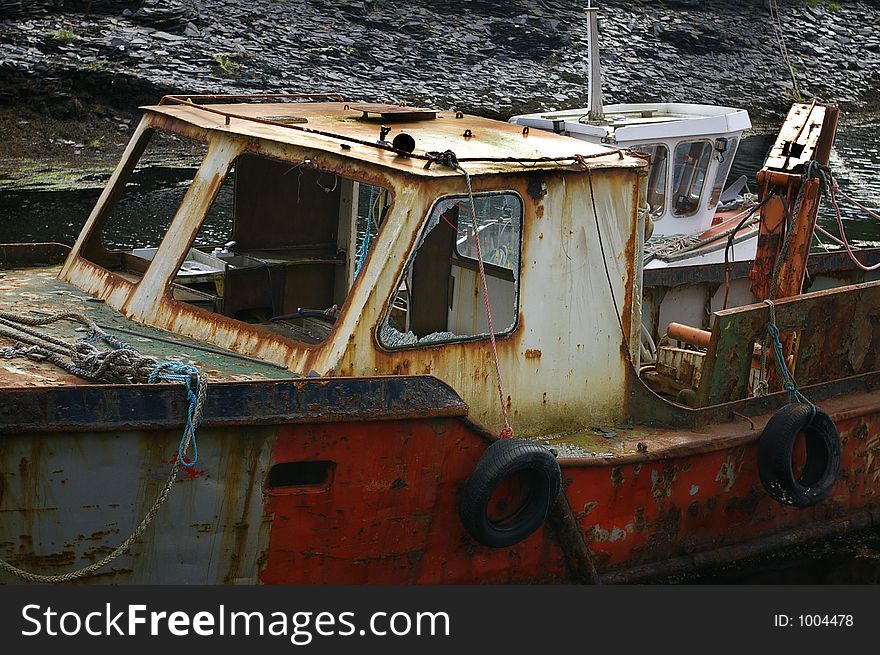 A photo of an old fishing boat. A photo of an old fishing boat