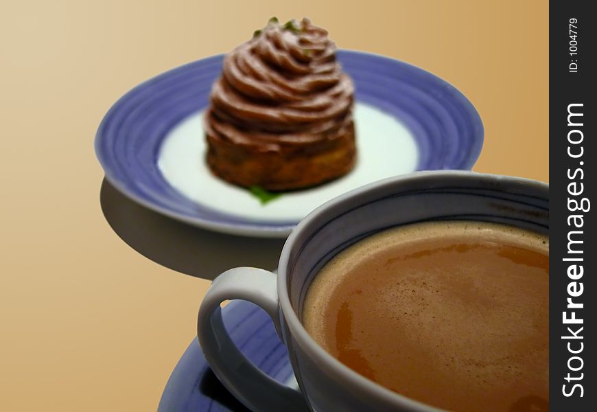 Still life with a coffee cup and cake. Selective focus on the coffee cup. Still life with a coffee cup and cake. Selective focus on the coffee cup.