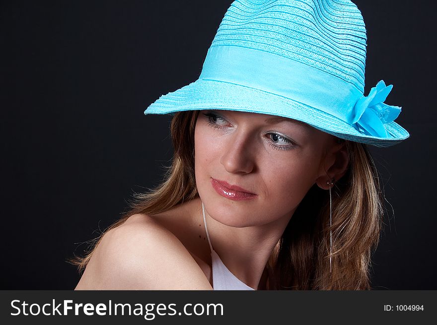 Young blonde girl with hat, close-up. Young blonde girl with hat, close-up