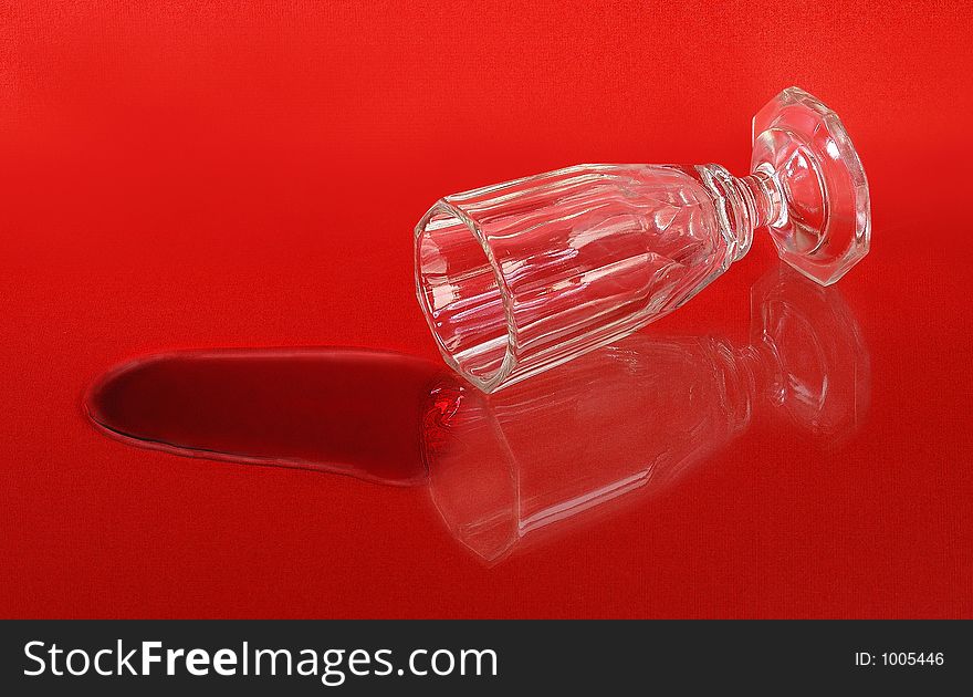 Liqueur glass on red background