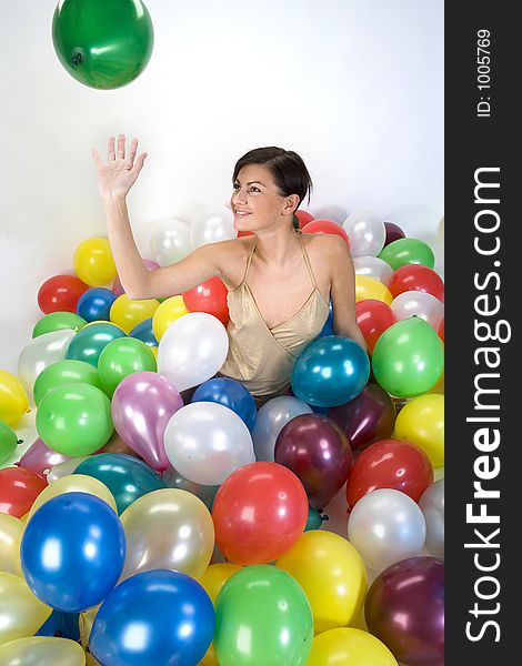 Smiled girl in colorful baloons