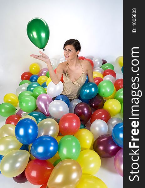 Smiled girl in colorful baloons