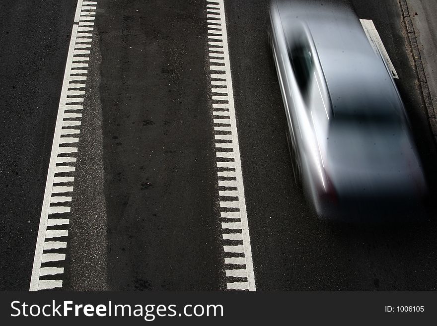 Traffic  on a street in denmark, shot from above (a bridge) with low shutter speed