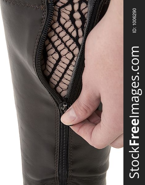 Woman opening boot zipper. Woman opening boot zipper