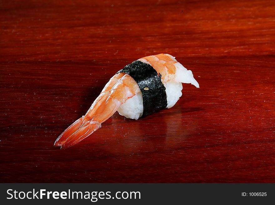 Sushi on wooden plate