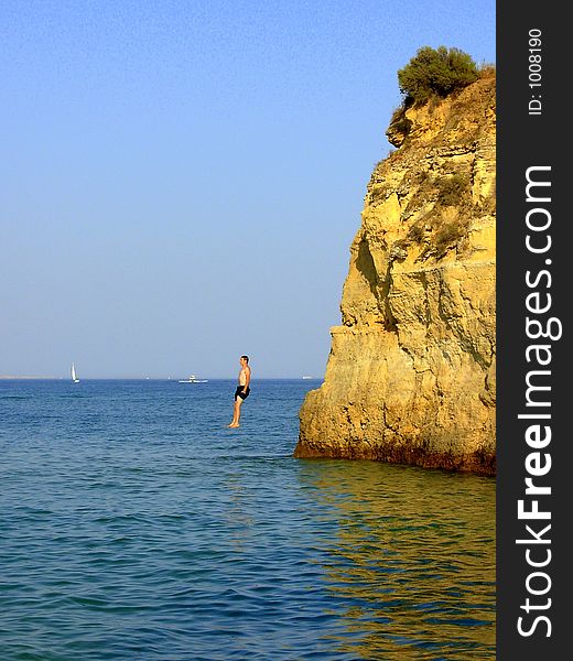 Swimmer in the Batata beach  in Algarve Lakes(Lagos) training of fast form divings for the sea. Swimmer in the Batata beach  in Algarve Lakes(Lagos) training of fast form divings for the sea.