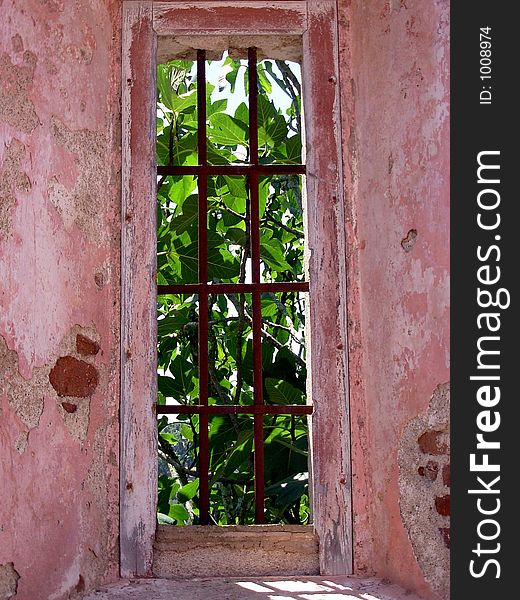 Image of Safira, village without inhabitants in the district of Ã‰vora, Portugal.Detail: Window of Church