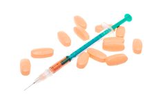 Syringe And Tablets Stock Photos