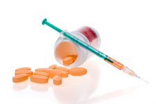 Syringe And Tablets Royalty Free Stock Image
