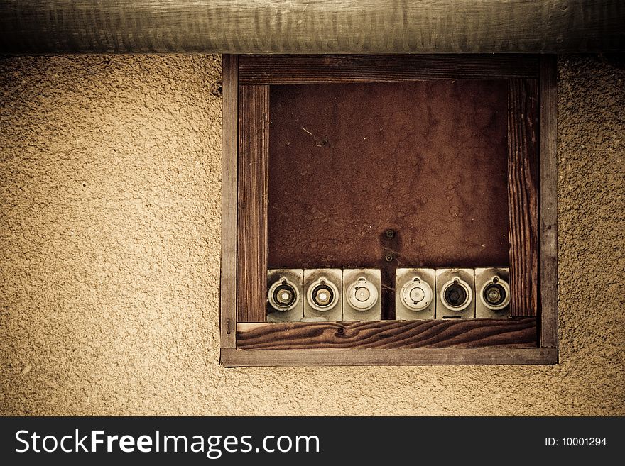 Old electric retro cupboard under rain gutter. Old electric retro cupboard under rain gutter