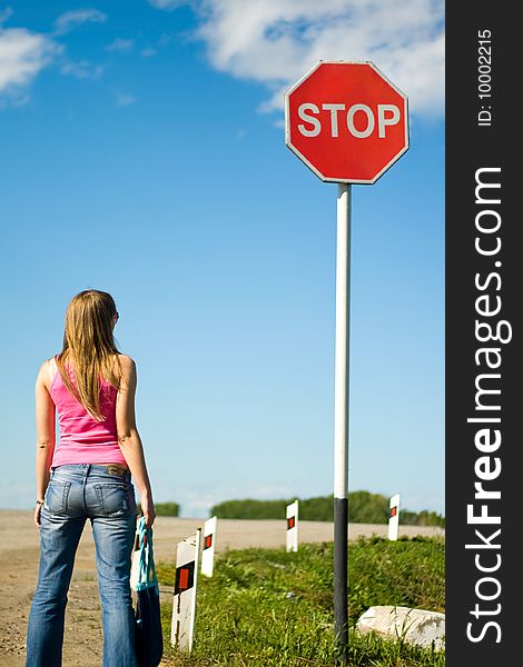 Young woman with a stop sign. Young woman with a stop sign