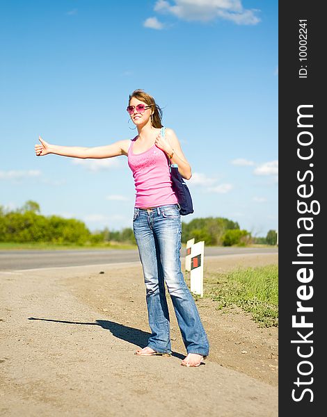 Young woman traveling by hitchhiker