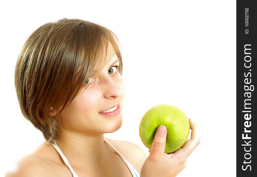 Attractive girl holding a green apple