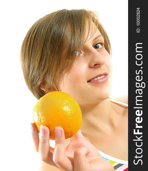 Portrait of a cute Caucasian blond girl with a nice colorful striped dress who is smiling and she is holding a fresh orange in her hand. Isolated on white. Portrait of a cute Caucasian blond girl with a nice colorful striped dress who is smiling and she is holding a fresh orange in her hand. Isolated on white.