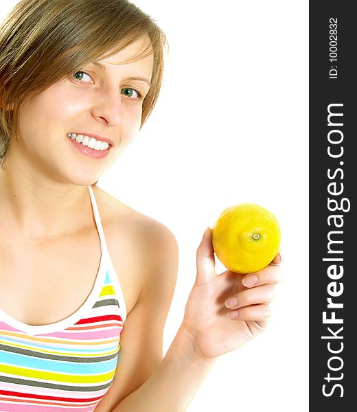 Portrait of a cute Caucasian blond girl with a nice colorful striped summer dress who is smiling and she is holding a fresh lemon in her hand. Isolated on white. Portrait of a cute Caucasian blond girl with a nice colorful striped summer dress who is smiling and she is holding a fresh lemon in her hand. Isolated on white.
