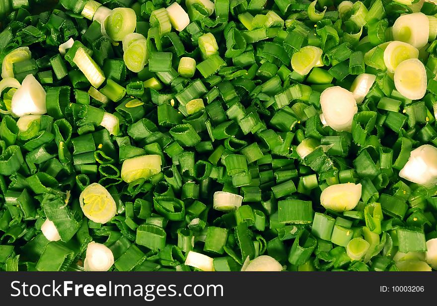 A close up view of fresh slices of green or spring onions. A close up view of fresh slices of green or spring onions.