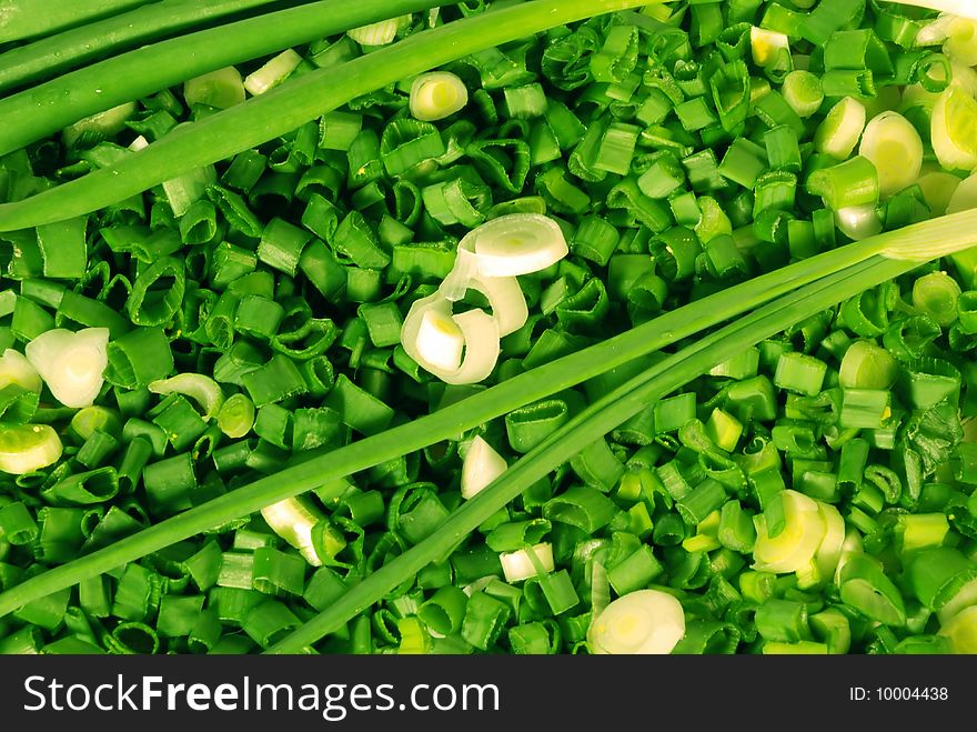 A close up view of fresh slices of green or spring onions. A close up view of fresh slices of green or spring onions.