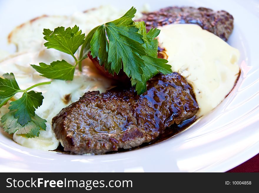 Sirloin strip Steak -Entrecote-with vegetables and savory bechamel-sauce.