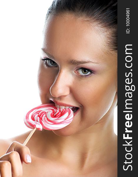 Beauty portrait of a young woman with a lollipop. Beauty portrait of a young woman with a lollipop