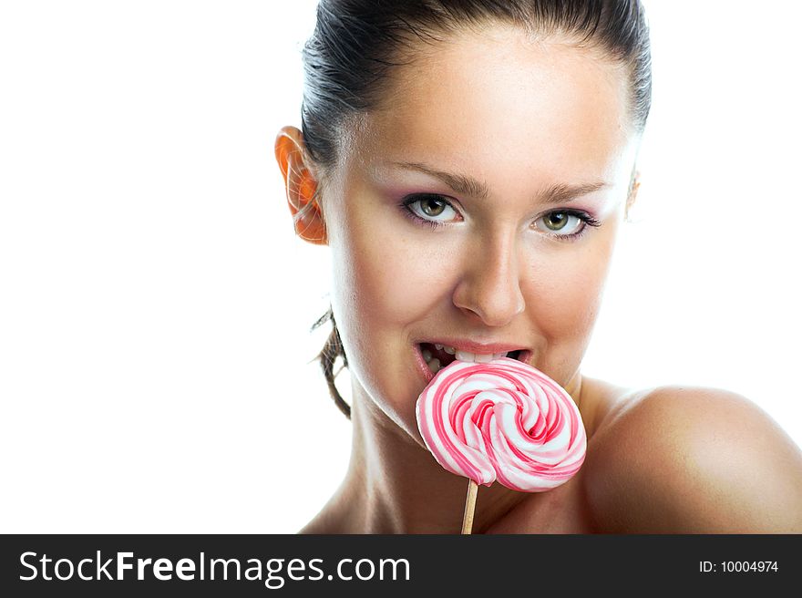 Beauty portrait of a young woman with a lollipop. Beauty portrait of a young woman with a lollipop