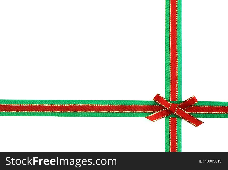 Red and green ribbon and bow isolated on white background