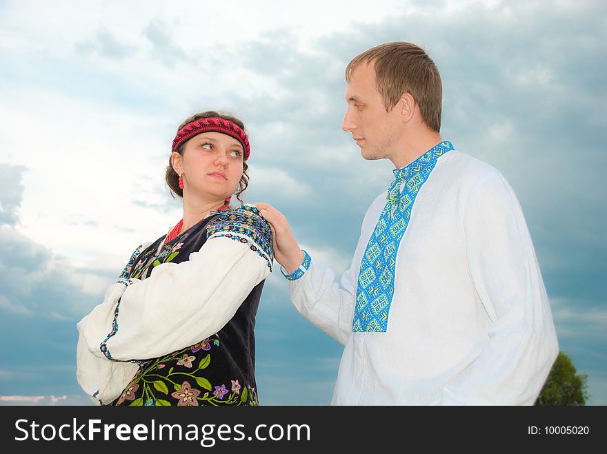 Young man touching a girl's shoulder. Young man touching a girl's shoulder