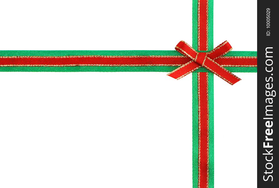 Red and green ribbon and bow isolated on white background