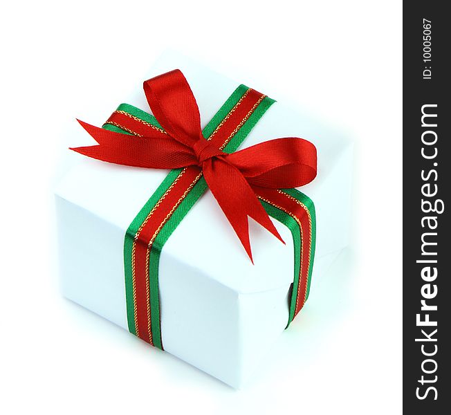 White gift box with red and green ribbon