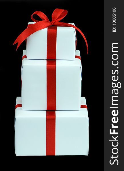 Three White Gift Boxes With Red Ribbon