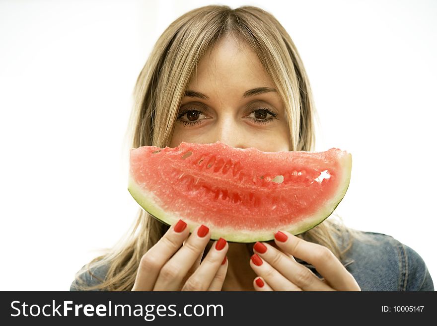 A young woman about to enjoy the perfect slice of watermelon. Isolated on white