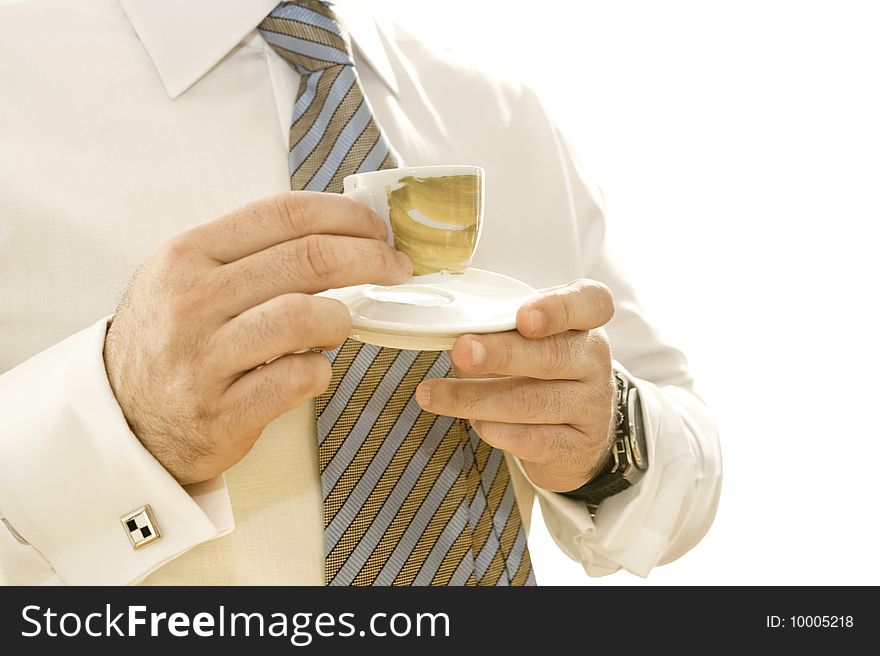 Businessman drinking coffee, isolated on white background