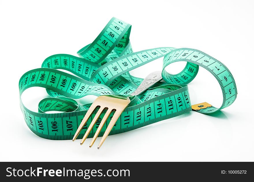 Cutlery with a measuring tape, diet, moderate eating. Cutlery with a measuring tape, diet, moderate eating