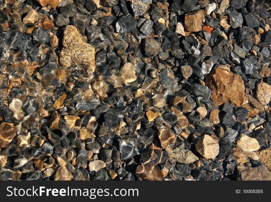 Pebbles at the bottom of river Satis, Central Russia.