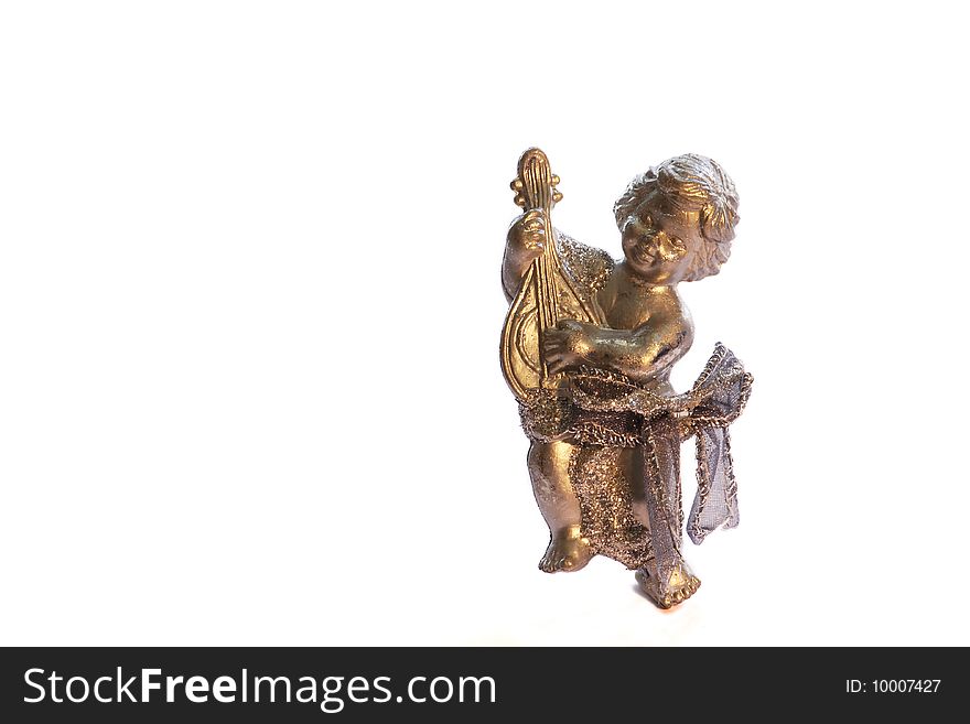 A bronze ornamental angel used for christmas decoration isolated on a white background. A bronze ornamental angel used for christmas decoration isolated on a white background