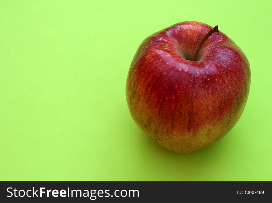 Red apple on a solid colored background. Red apple on a solid colored background